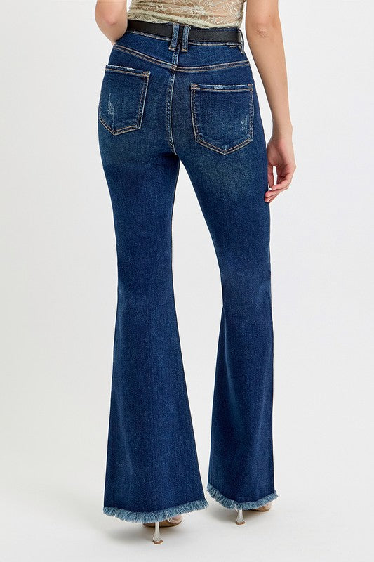 Back view of flare jeans with frayed hem and pockets.