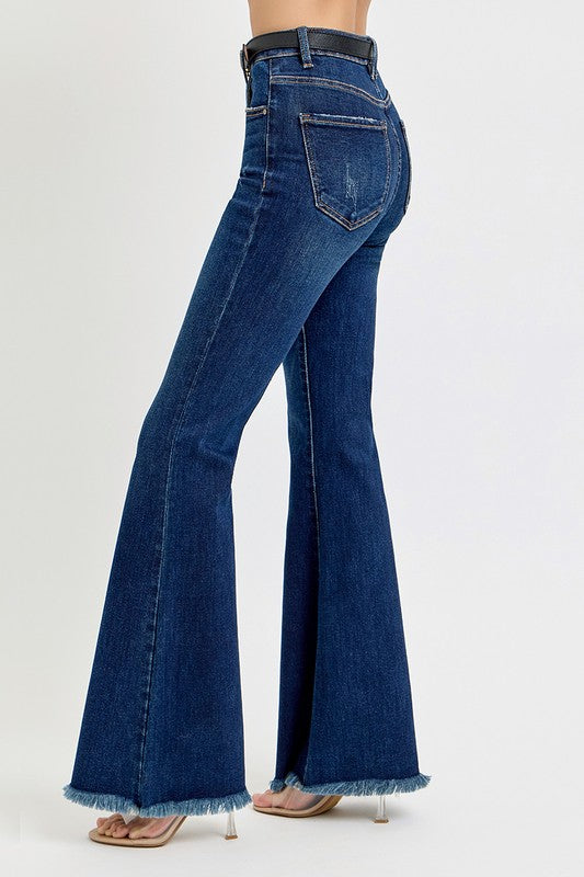 Side view of high rise flare jeans with frayed hem.