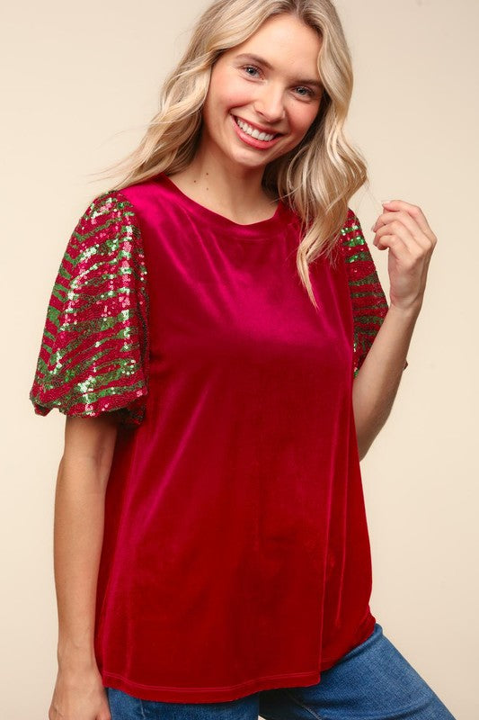 Front view of red velvet top with sequin sleeves