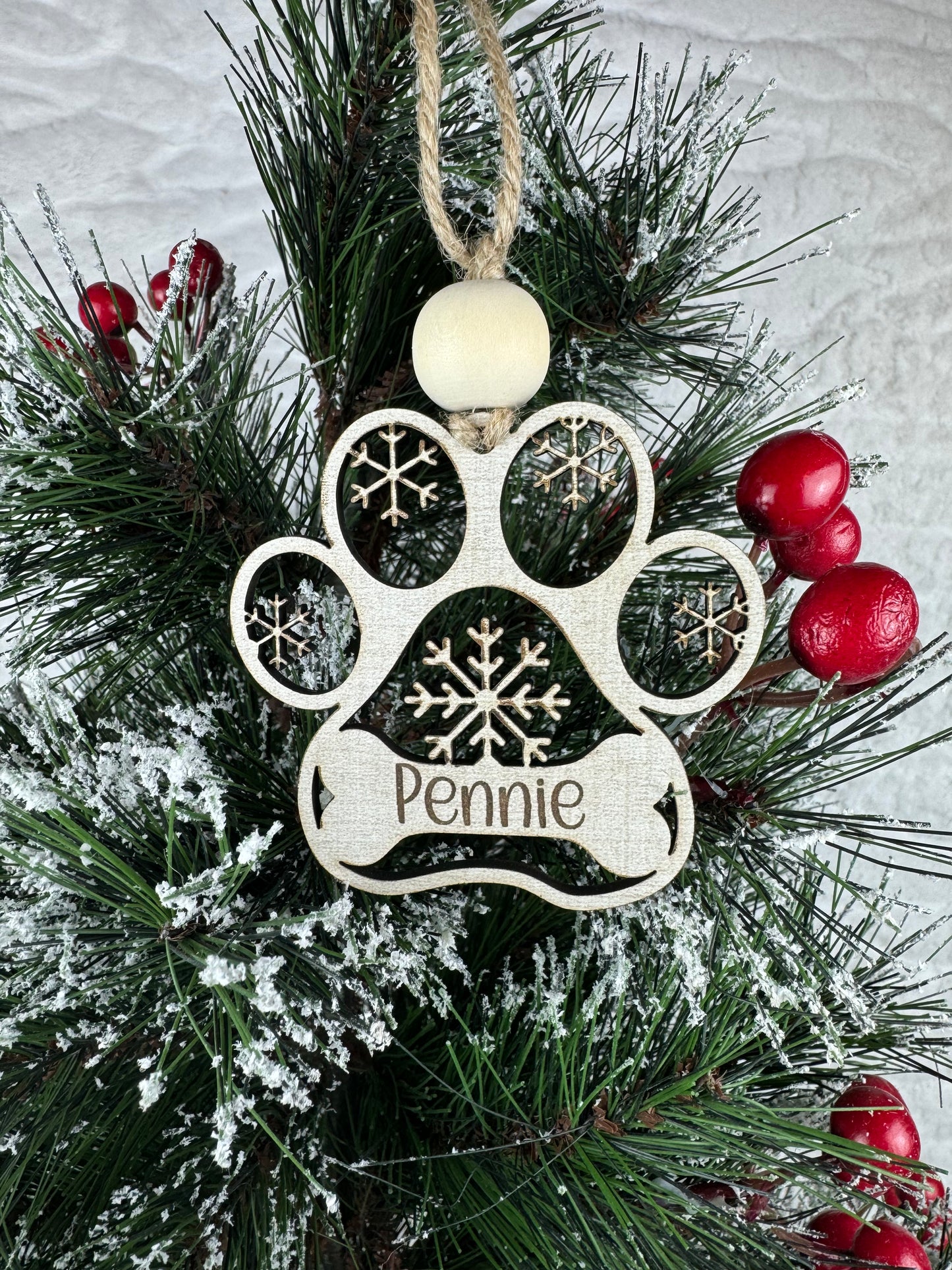 Personalized dog ornament with snowflakes on tree