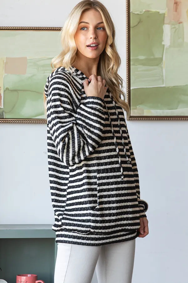 Side view of striped puff sleeve hoodie indoors