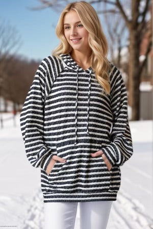Striped puff sleeve hoodie in snowy outdoor setting