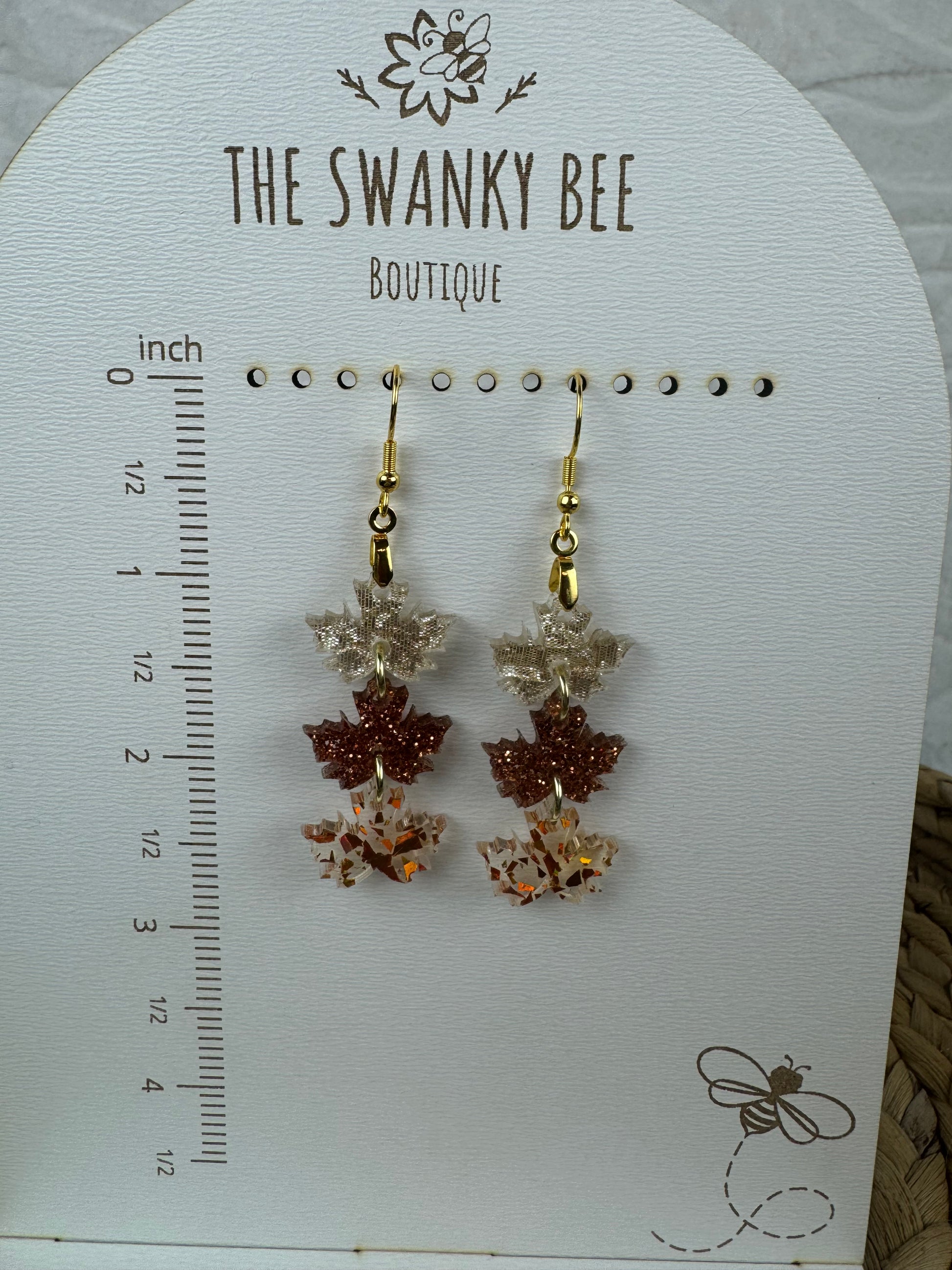 Nature-themed leaf earrings on display