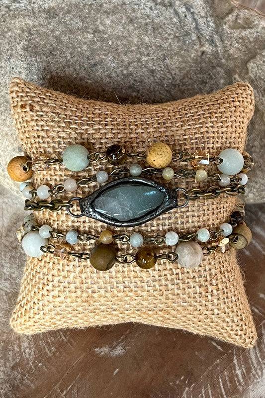 Buy Emory Bracelet 5 strand design with mixed bead textures and central crystal accent. Unique handcrafted jewelry piece.