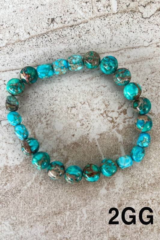Vibrant turquoise Stone Bead Bracelets with brown veining, great for a bold, natural accessory in any jewelry ensemble.