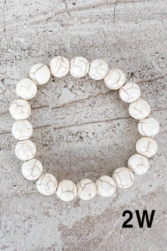 White crackle-effect Stone Bead Bracelets with a polished finish, offering a clean and modern look for any outfit.
