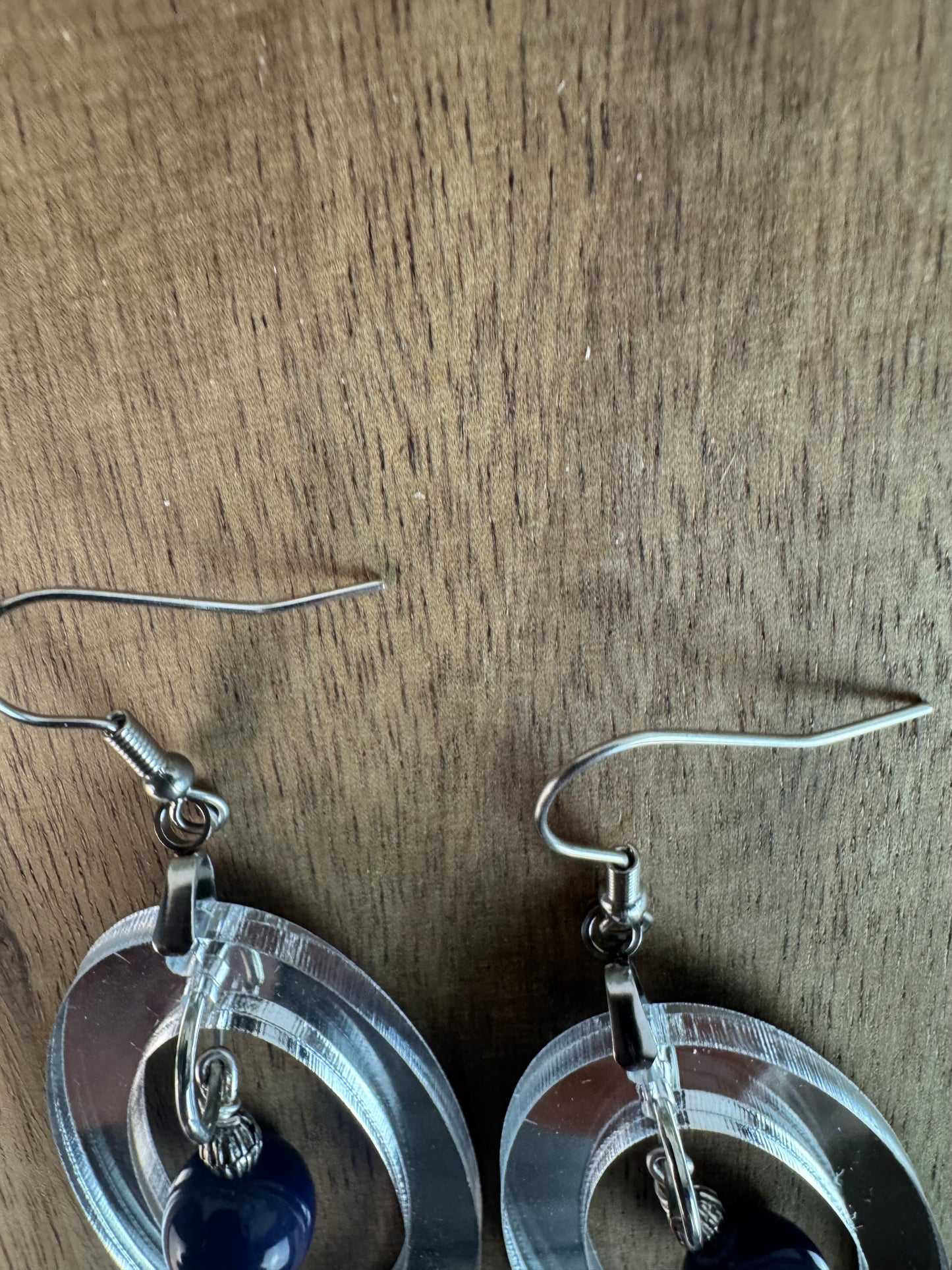 Silver Mirror Acrylic Oval Earrings with Blue Dangle Bead