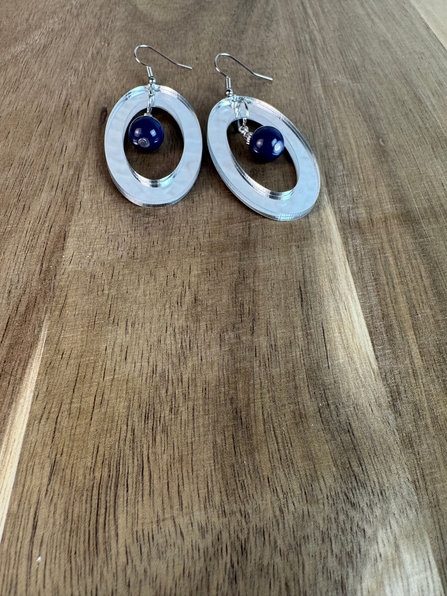Silver Mirror Acrylic Oval Earrings with Blue Dangle Bead
