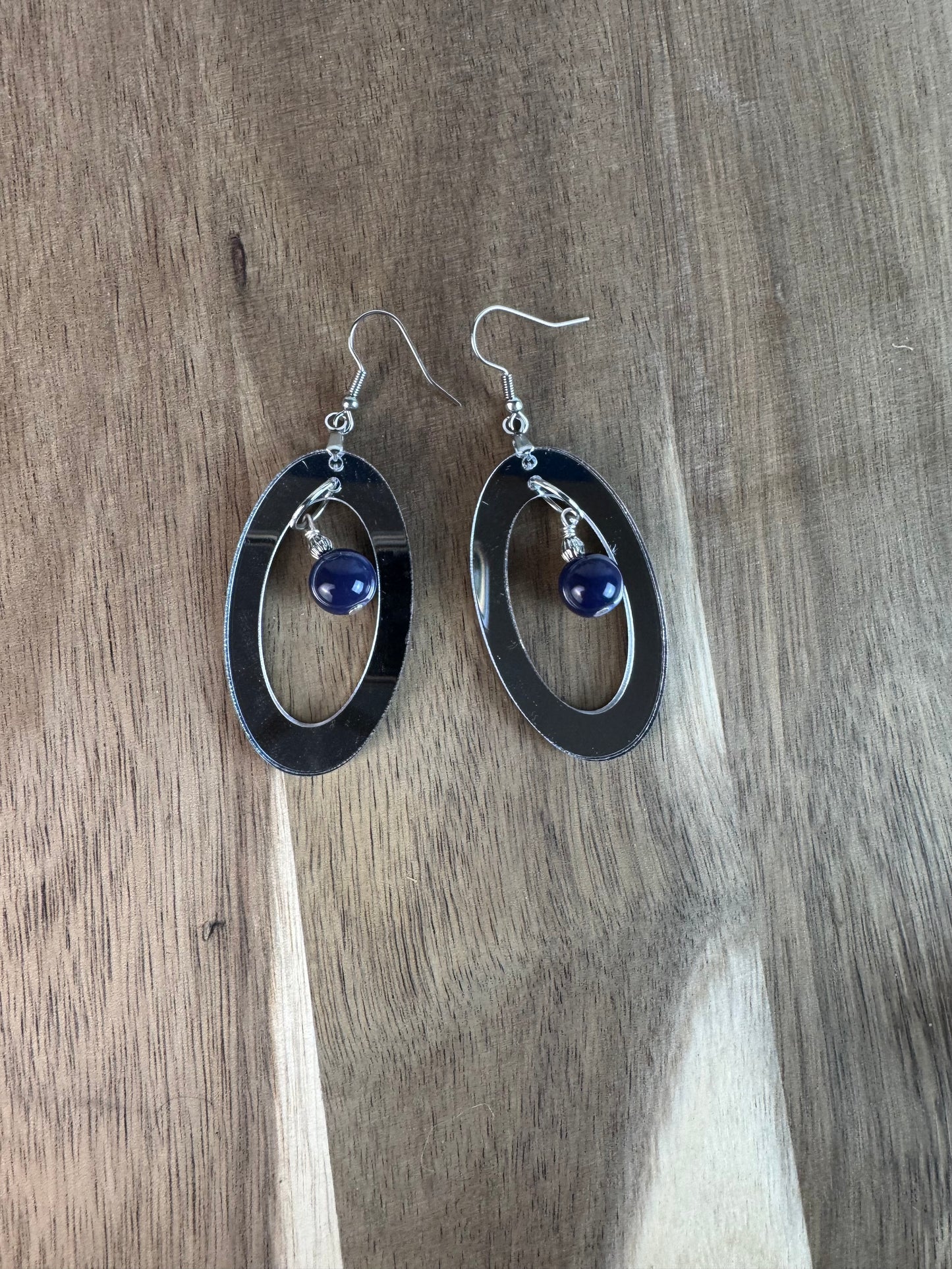 Silver Mirror Acrylic Oval Earrings with Blue Dangle Bead