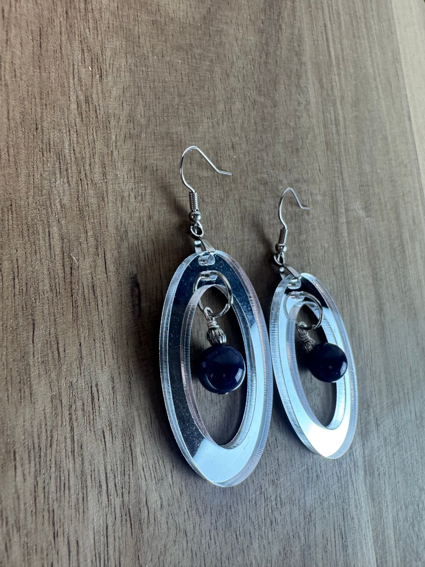 Silver Mirror Acrylic Oval Earrings with Blue Dangle Bead