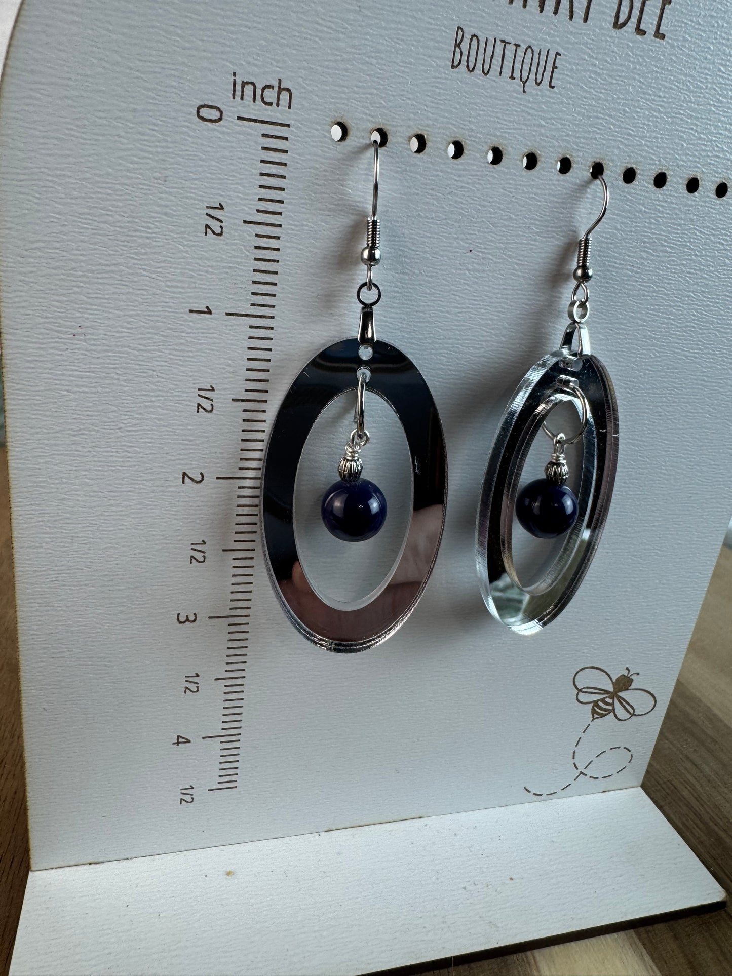 Silver Mirror Acrylic Oval Earrings with Blue Dangle Bead