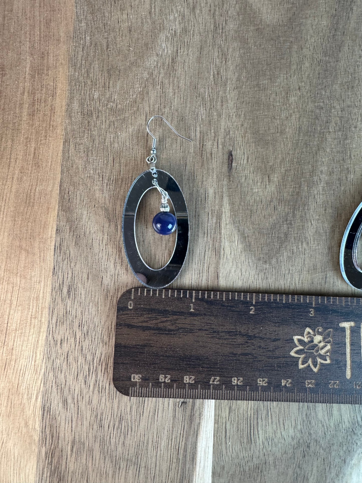 Silver Mirror Acrylic Oval Earrings with Blue Dangle Bead